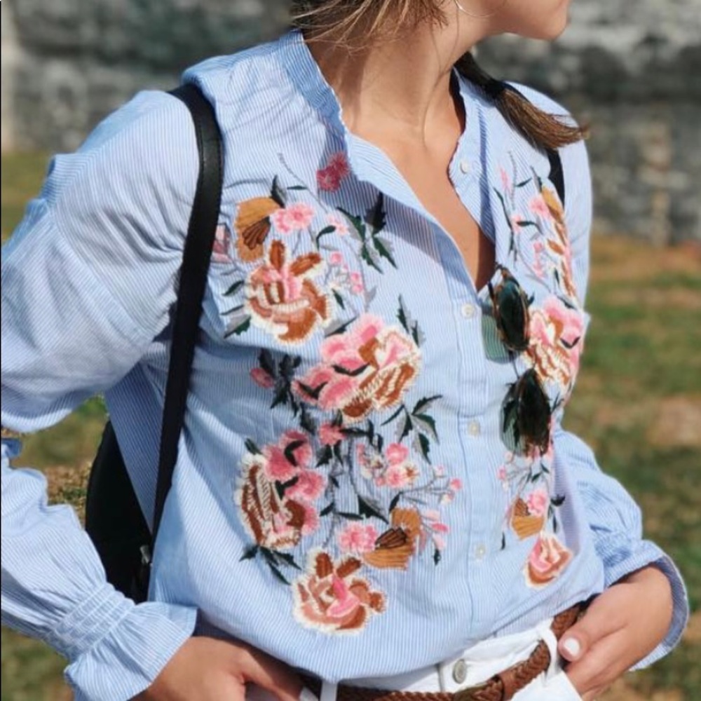 Long sleeve blue and white top with floral design